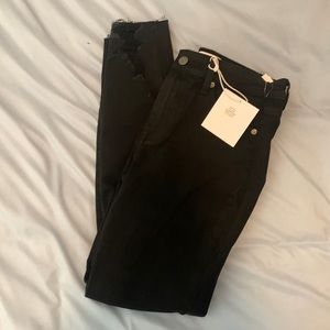 Black skinny jeans, ripped bottoms